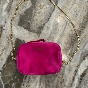 Hot pink Prada cosmetic bag with crossbody chain